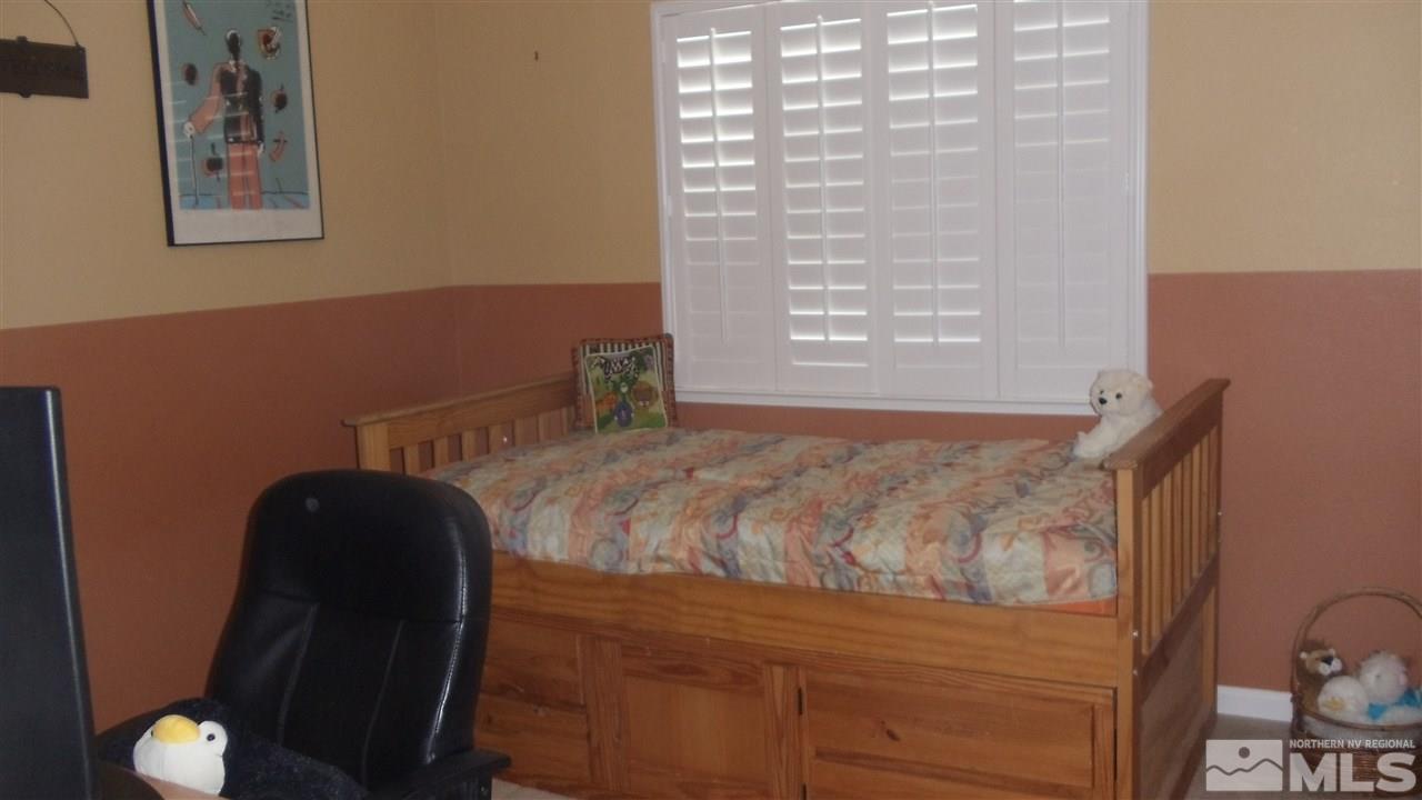 723 Silver Mine Court Reno, NV 89521 - Photo 11 of 17 a bedroom with a bed and window