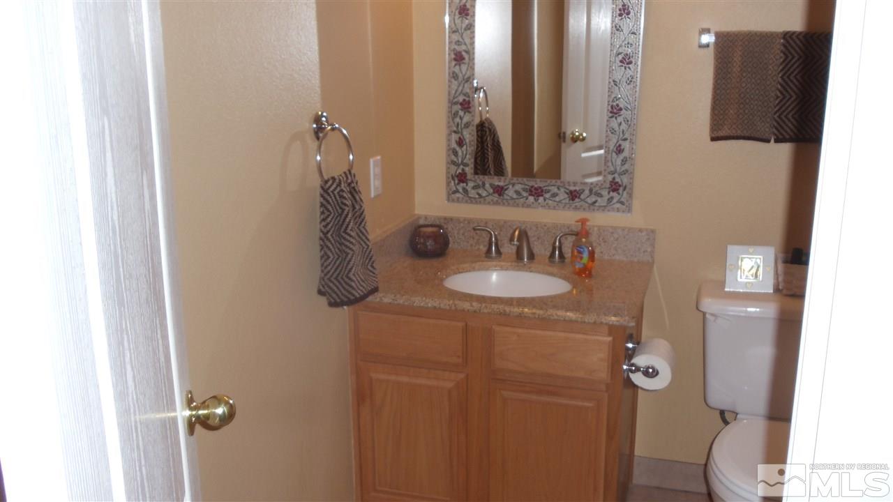 723 Silver Mine Court Reno, NV 89521 - Photo 13 of 17 a bathroom with a sink vanity and mirror