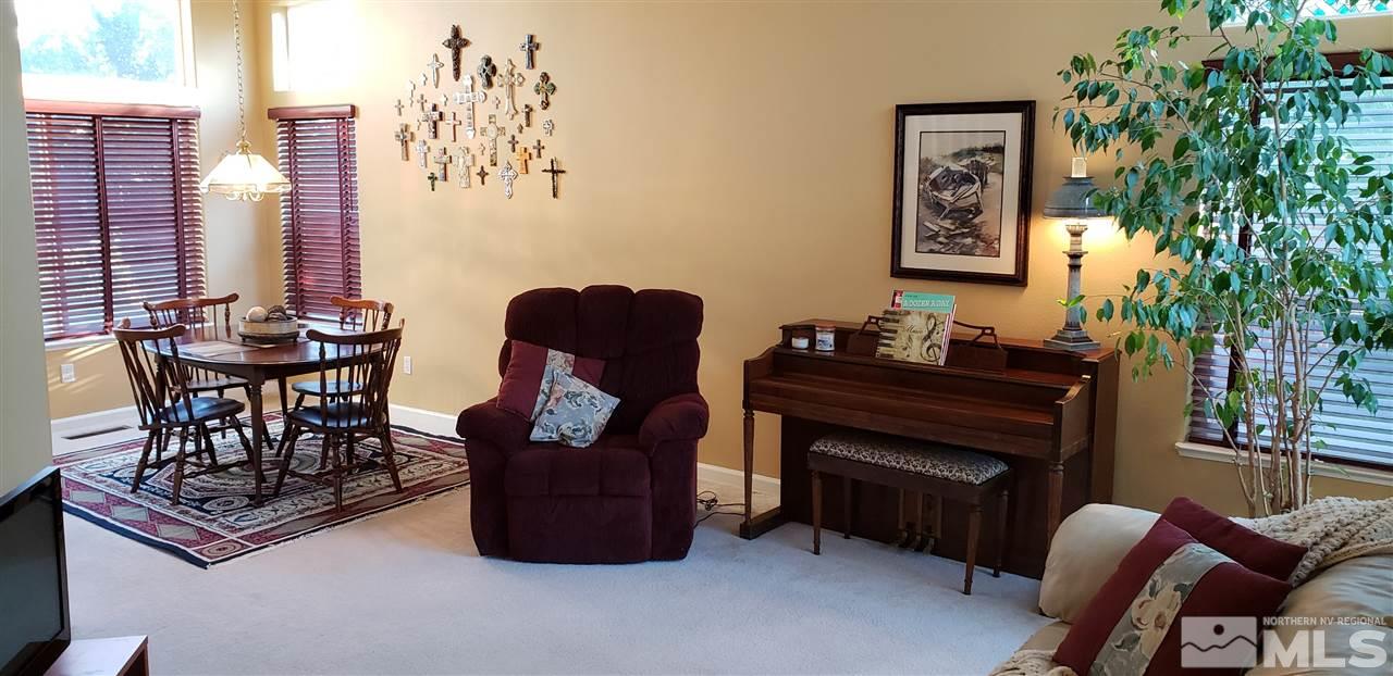 723 Silver Mine Court Reno, NV 89521 - Photo 2 of 17 a living room with furniture and a potted plant
