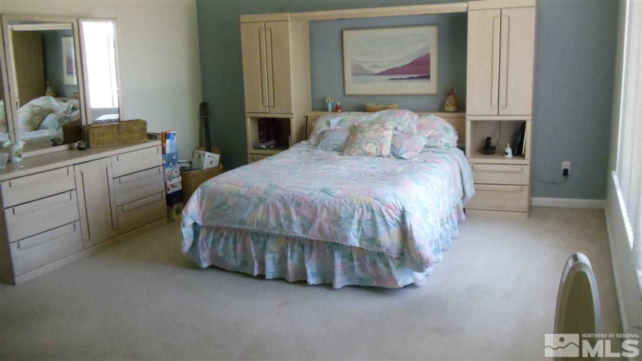 723 Silver Mine Court Reno, NV 89521 - Photo 7 of 17 a bedroom with a bed and a painting on the wall