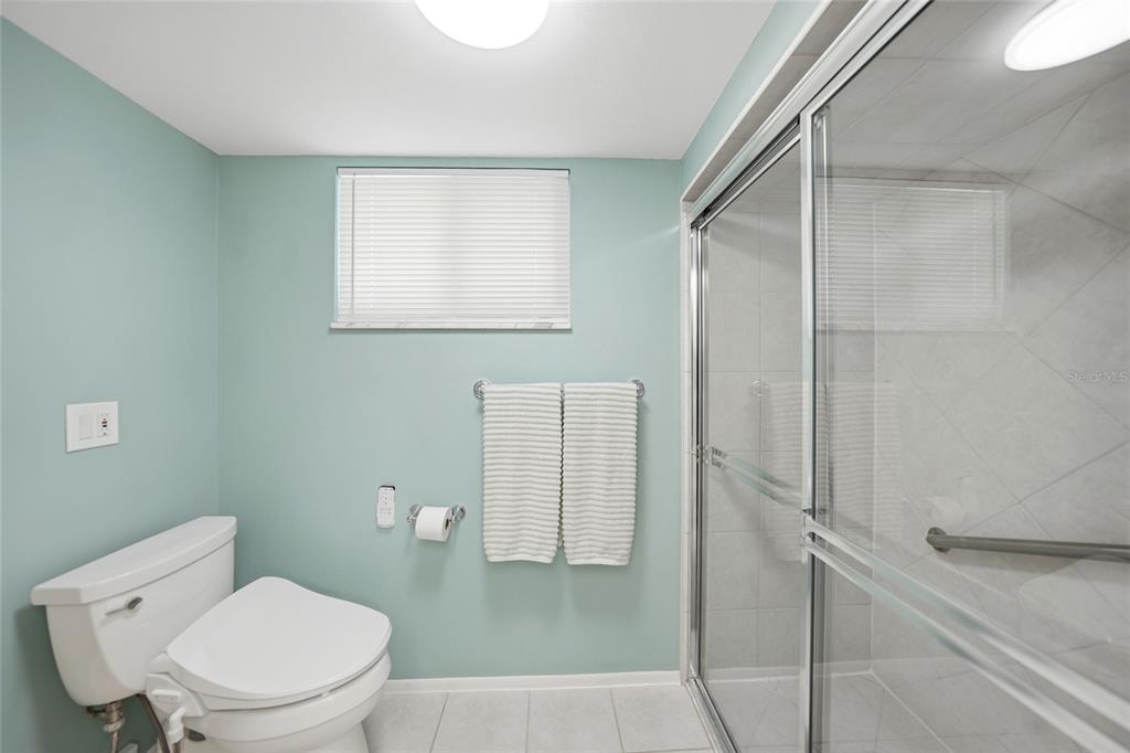 1 Colony Point Drive, Unit A10 Punta Gorda, FL 33950 - Photo 25 of 31 a white toilet sitting next to a bathroom sink