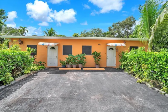 front view of a house with a yard