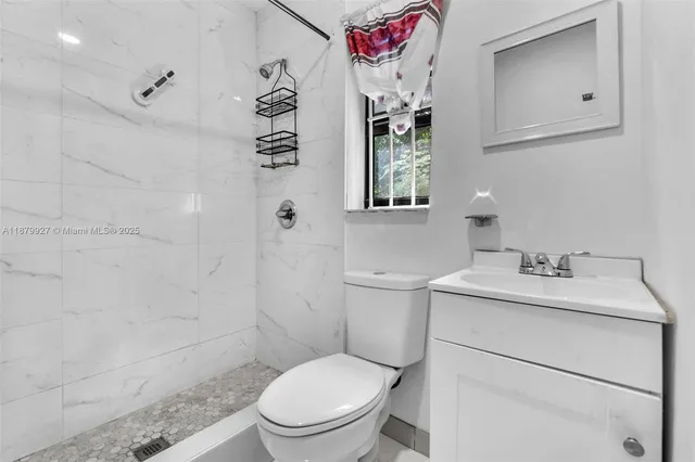 a living room with furniture a rug and a chandelier