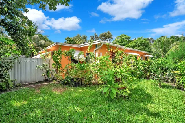 an aerial view of a house with yard and outdoor space