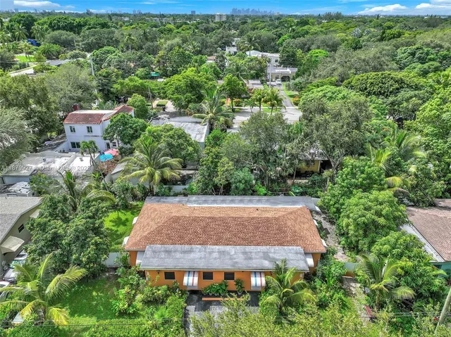 a bed room with a bed and a large window