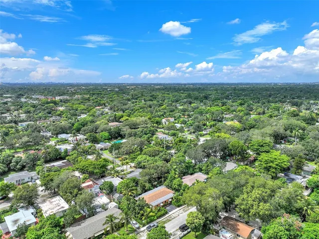 a kitchen with stainless steel appliances granite countertop a stove and a microwave