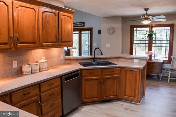 a spacious bedroom with a bed and a chandelier