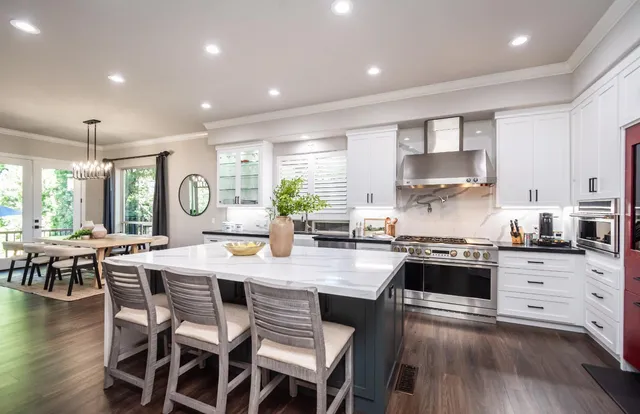 an aerial view of residential houses with outdoor space and street view