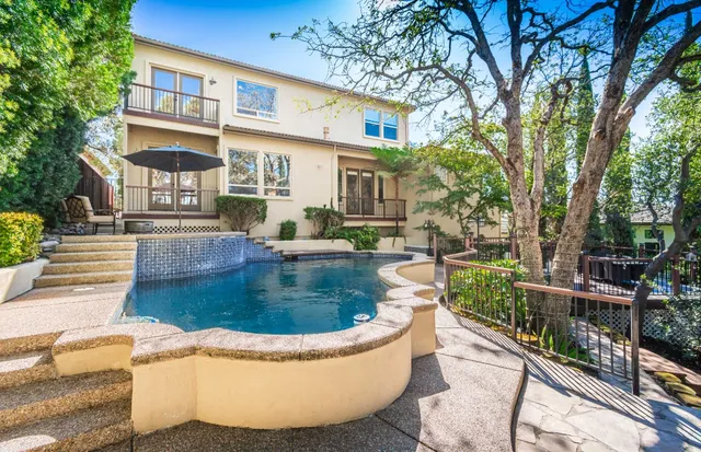 a view of a deck with wooden floor and outdoor seating