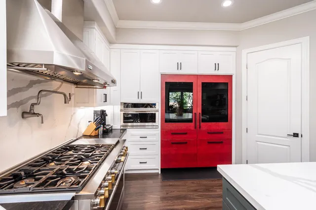 a view of an entryway with wooden floor