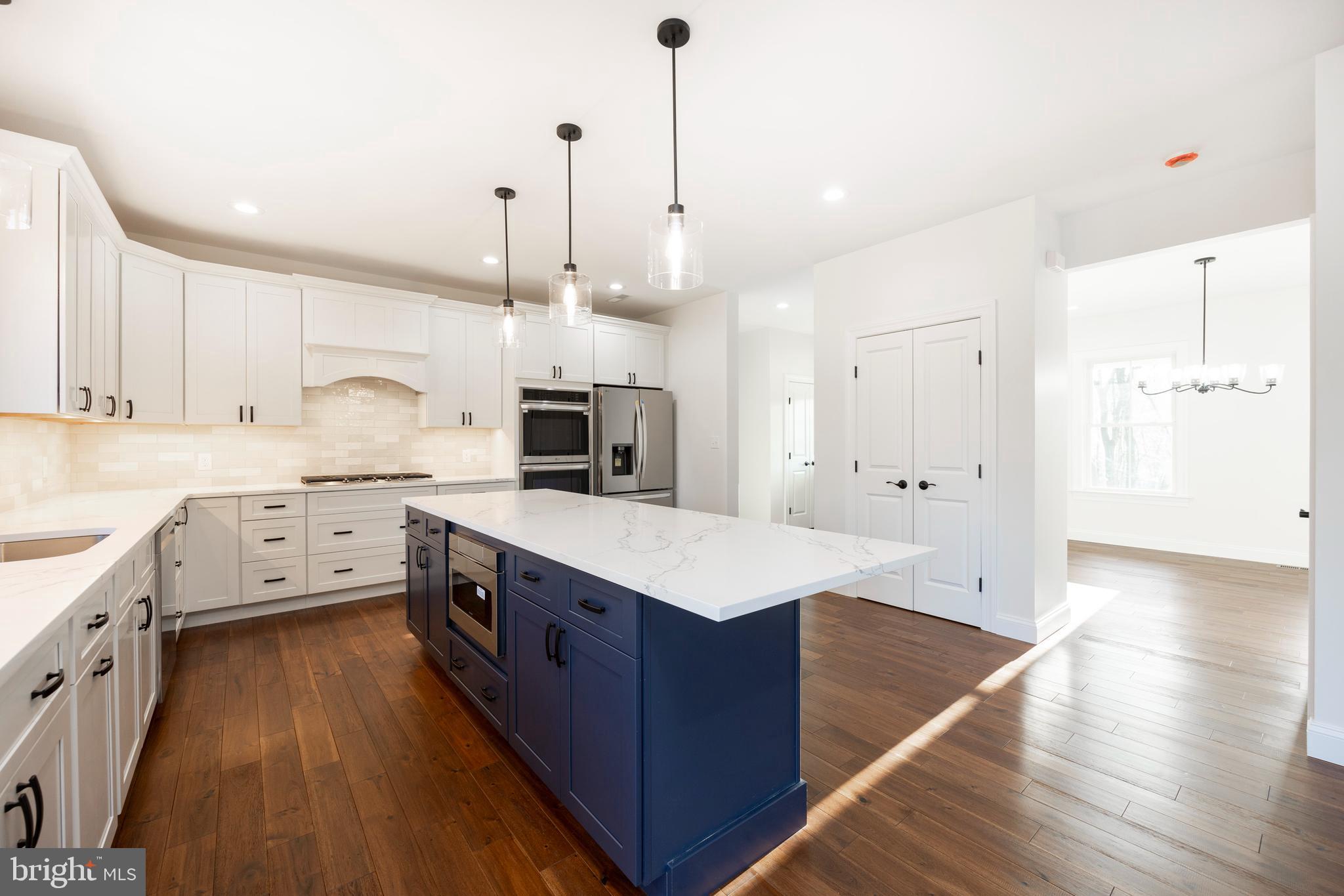 660 Little Conestoga Road Downingtown, PA 19335 - Photo 15 of 56 a kitchen with stove cabinets and wooden floor