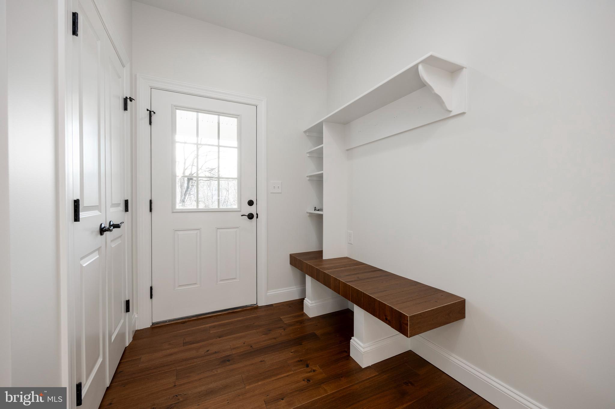 660 Little Conestoga Road Downingtown, PA 19335 - Photo 17 of 56 a room with a bench and wooden floor