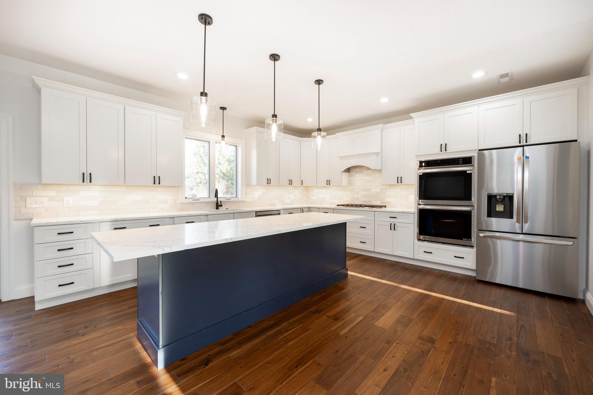 660 Little Conestoga Road Downingtown, PA 19335 - Photo 19 of 56 a large kitchen with cabinets wooden floor and stainless steel appliances