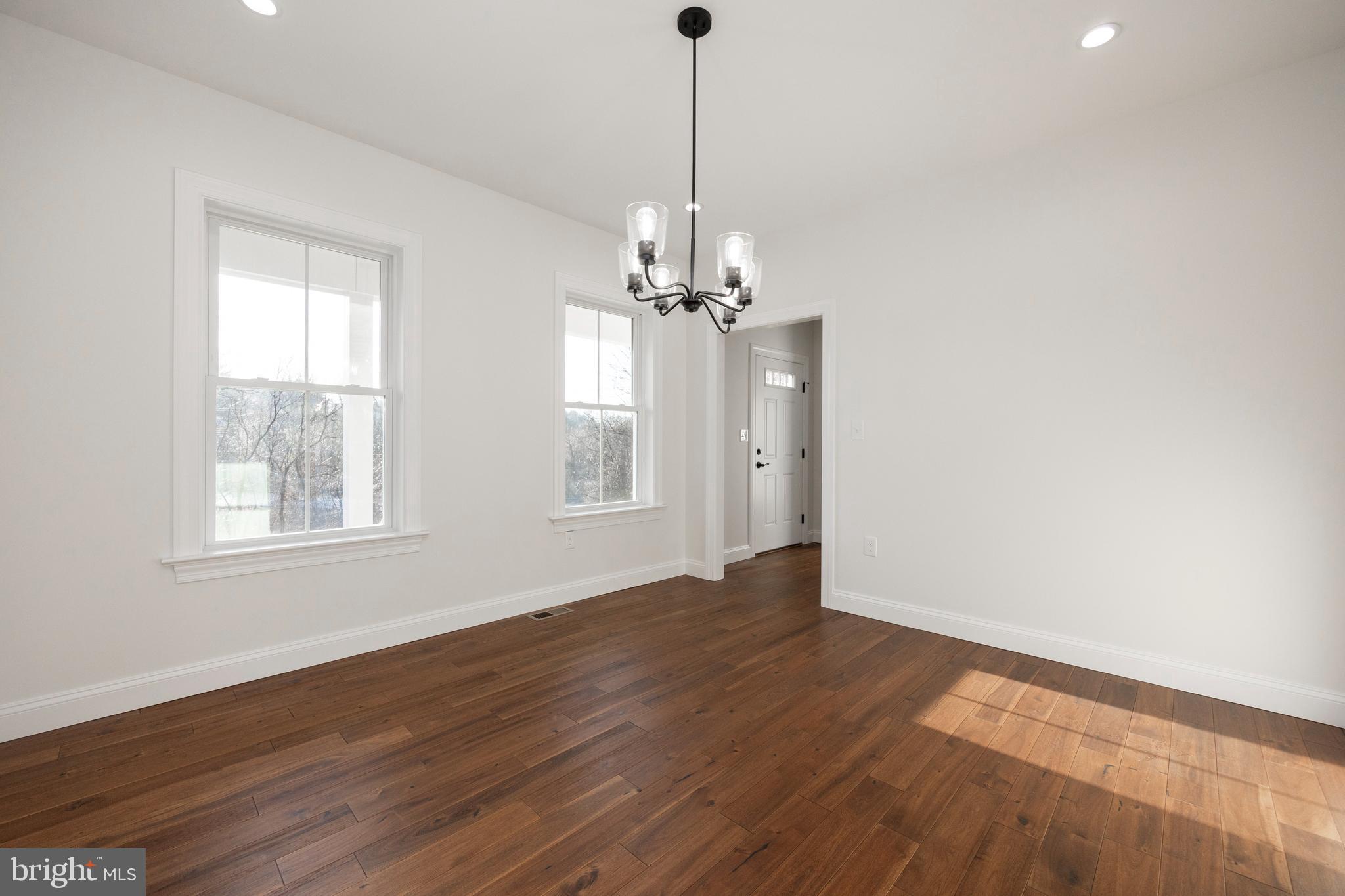660 Little Conestoga Road Downingtown, PA 19335 - Photo 20 of 56 a view of a room with wooden floor chandelier and window