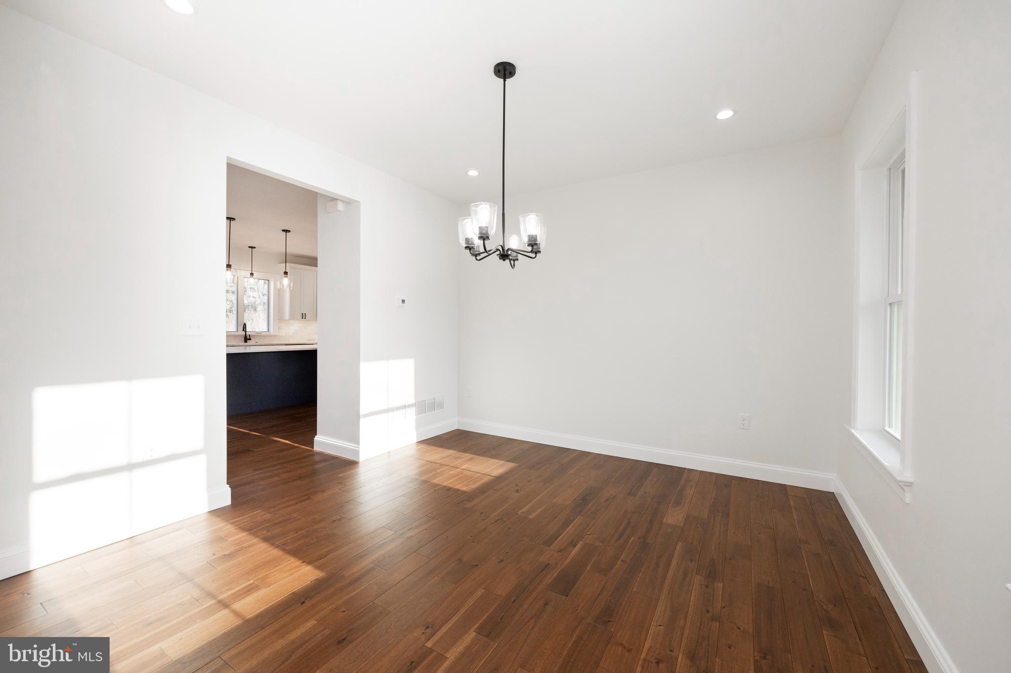 660 Little Conestoga Road Downingtown, PA 19335 - Photo 22 of 56 a view of a room with wooden floor and kitchen view