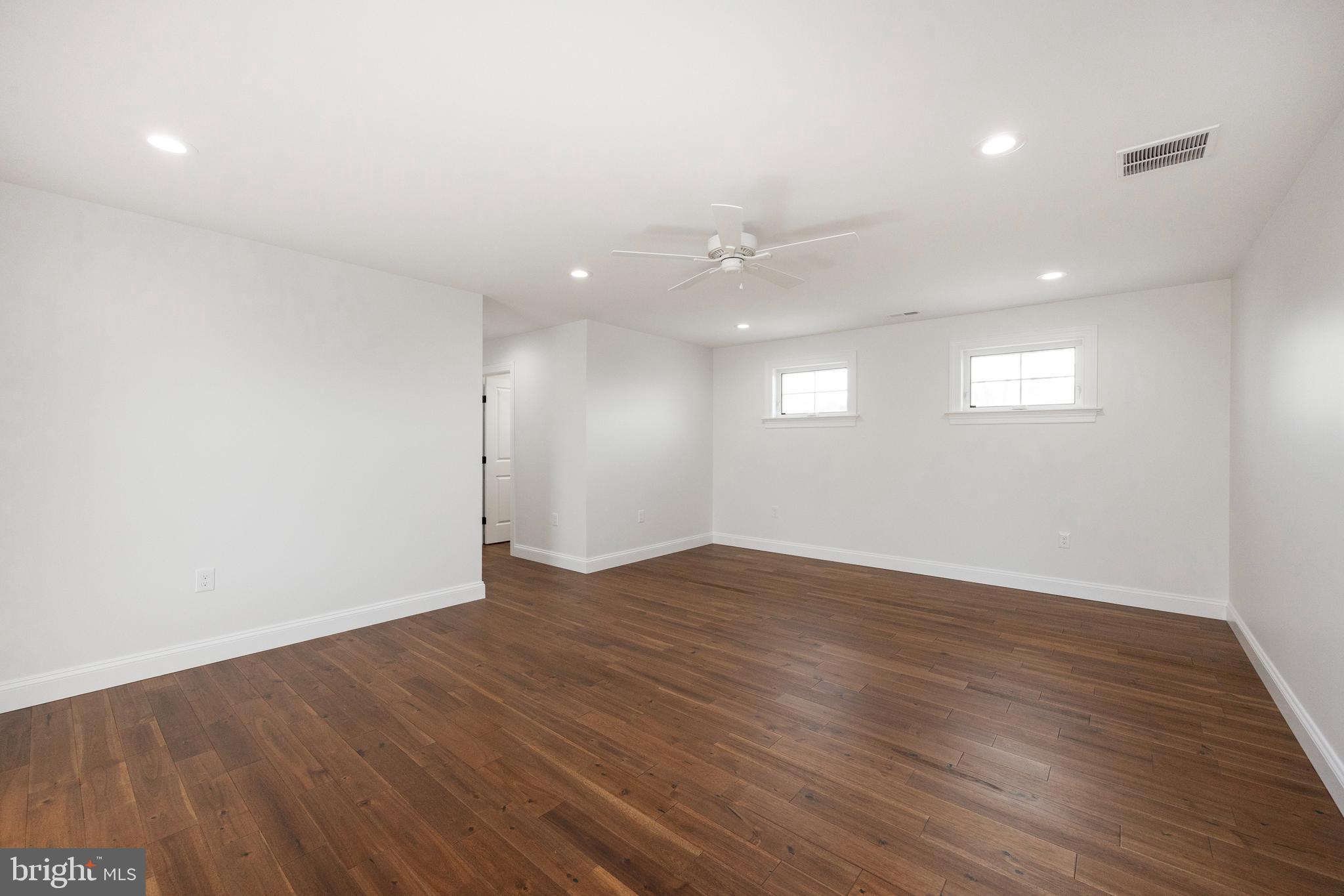 660 Little Conestoga Road Downingtown, PA 19335 - Photo 23 of 56 an empty room with wooden floor and windows