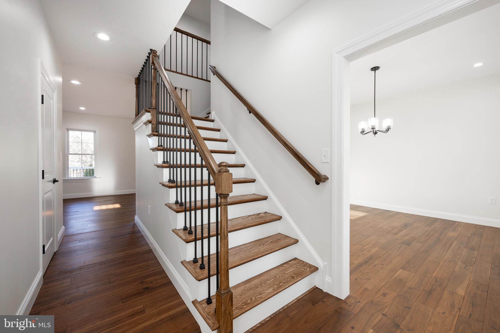 660 Little Conestoga Road Downingtown, PA 19335 - Photo 28 of 56 a view of a hallway with wooden floor and stairs
