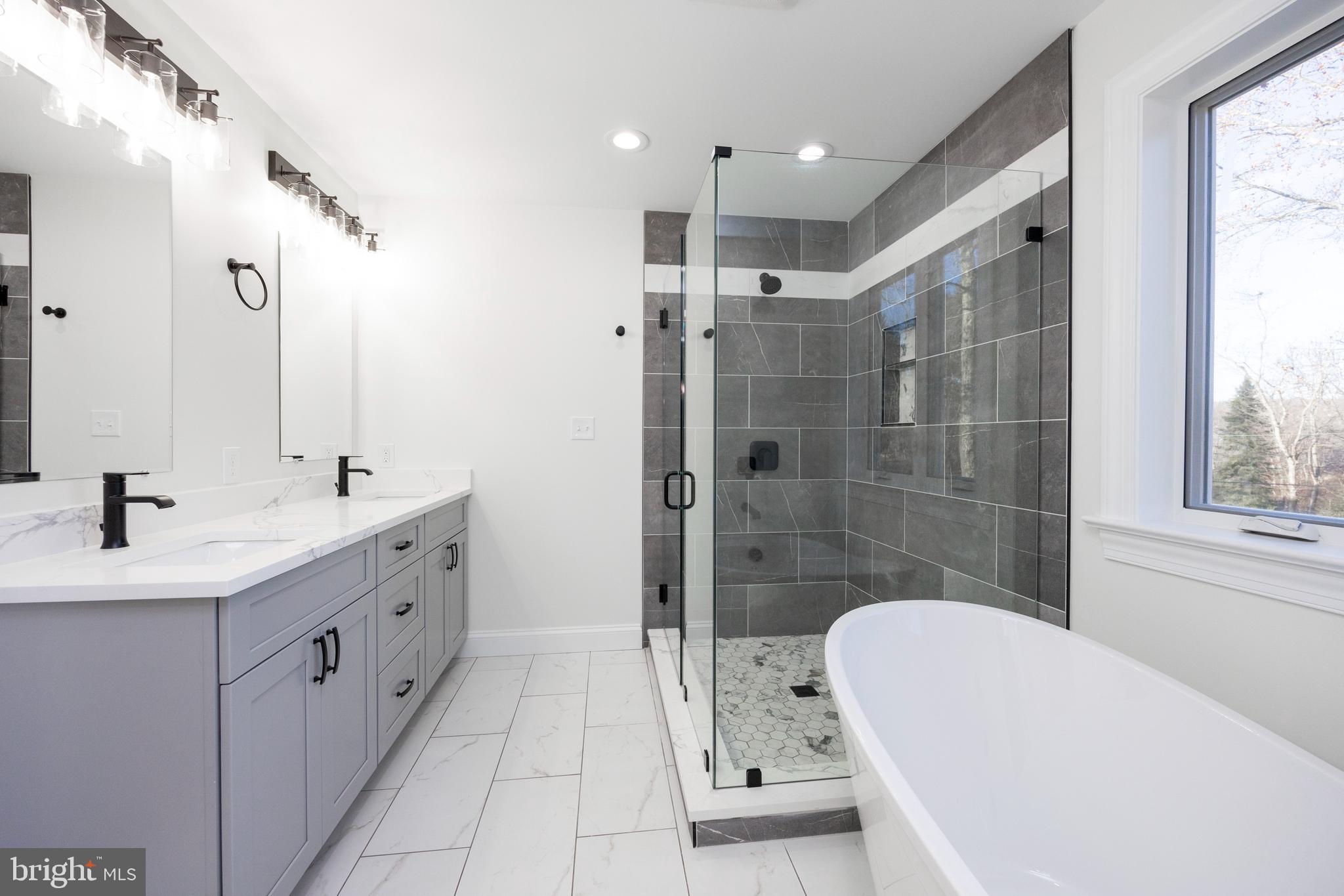 660 Little Conestoga Road Downingtown, PA 19335 - Photo 30 of 56 a bathroom with a tub sink toilet and shower