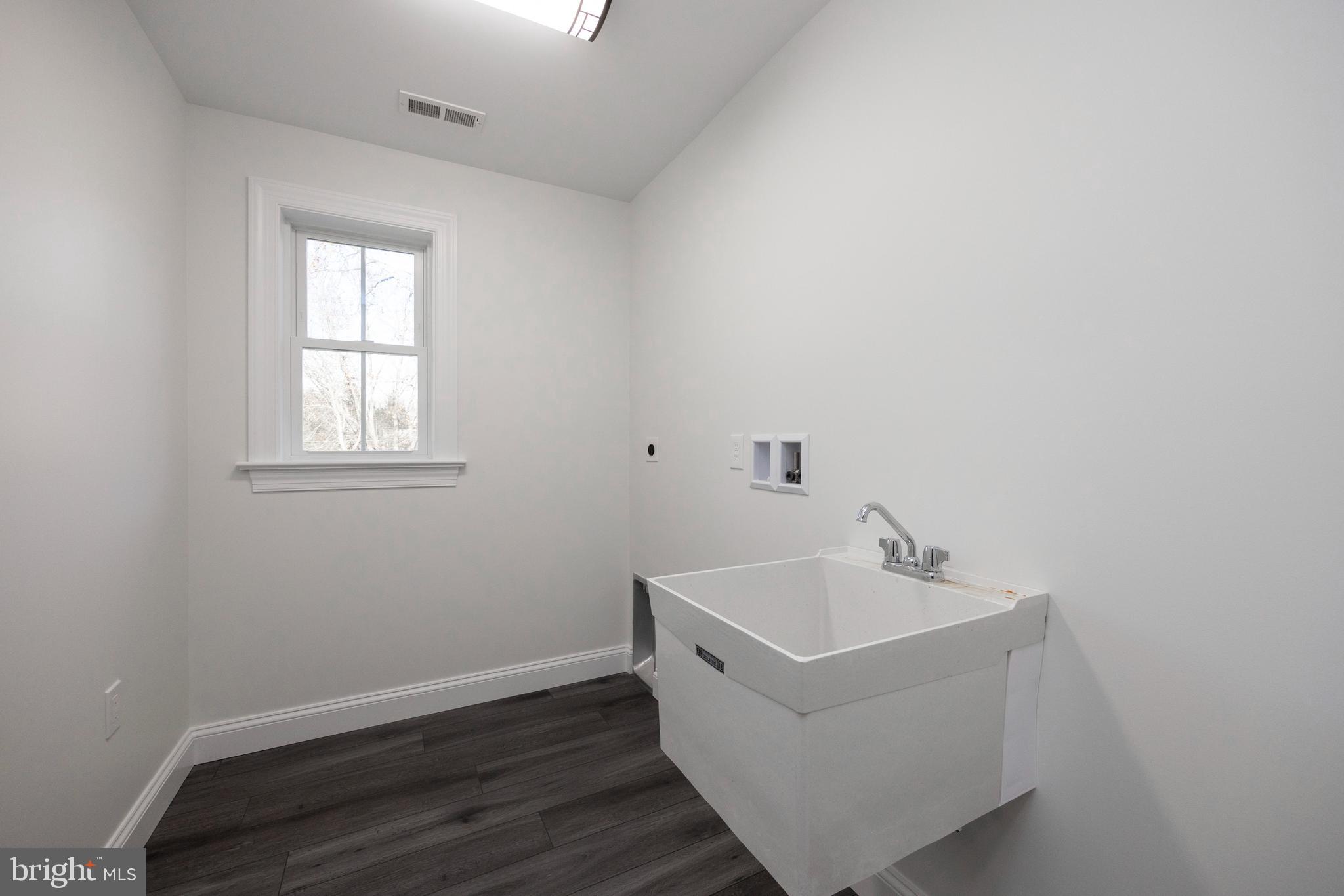 660 Little Conestoga Road Downingtown, PA 19335 - Photo 31 of 56 a bathroom with a sink and a window