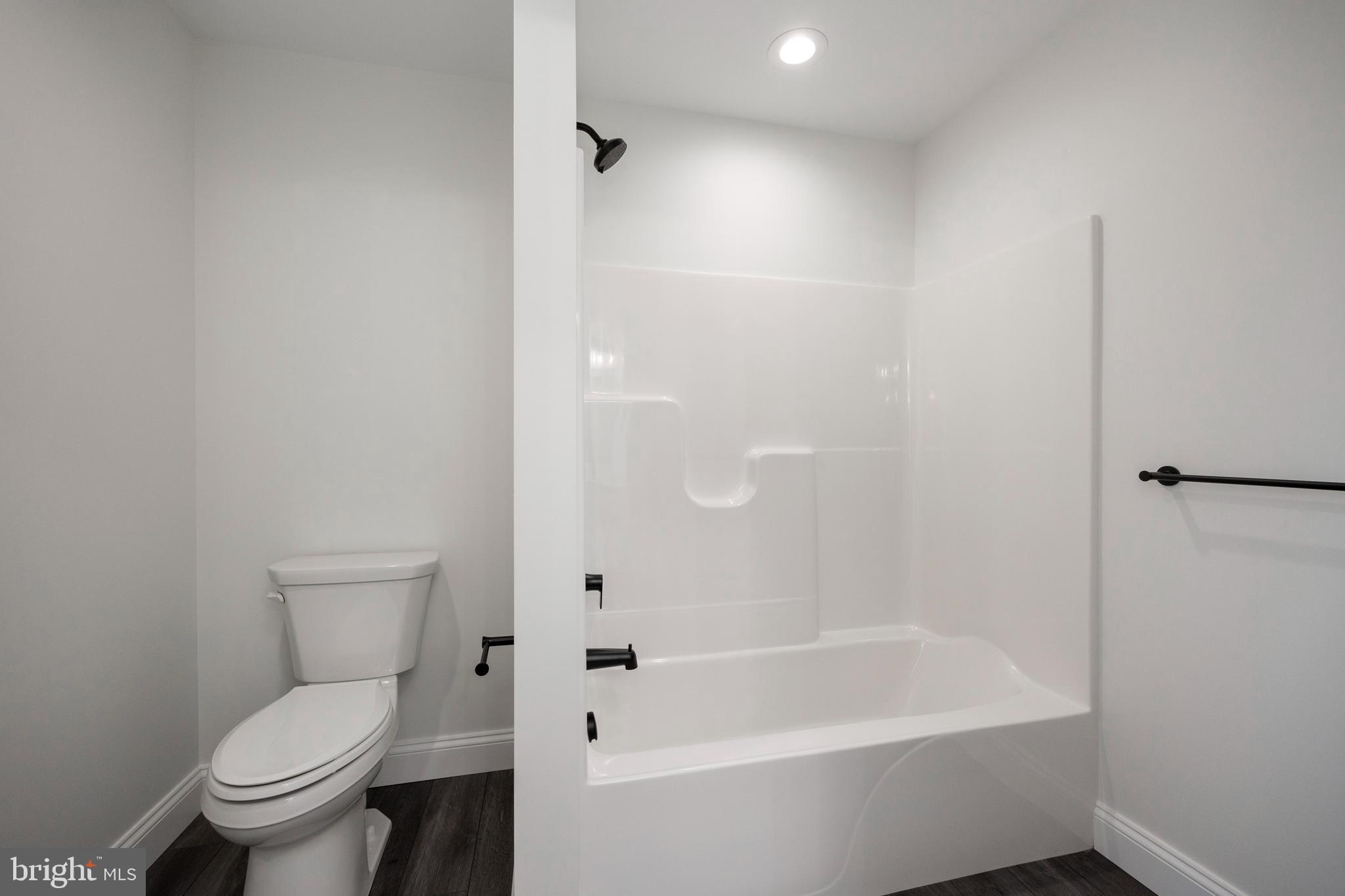 660 Little Conestoga Road Downingtown, PA 19335 - Photo 33 of 56 a white toilet sitting next to a bath tub