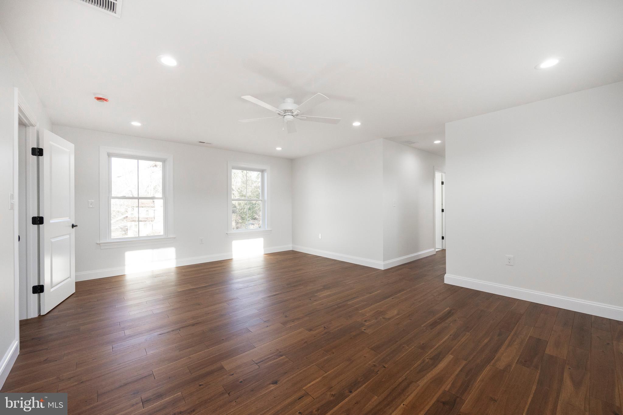 660 Little Conestoga Road Downingtown, PA 19335 - Photo 38 of 56 an empty room with wooden floor and windows