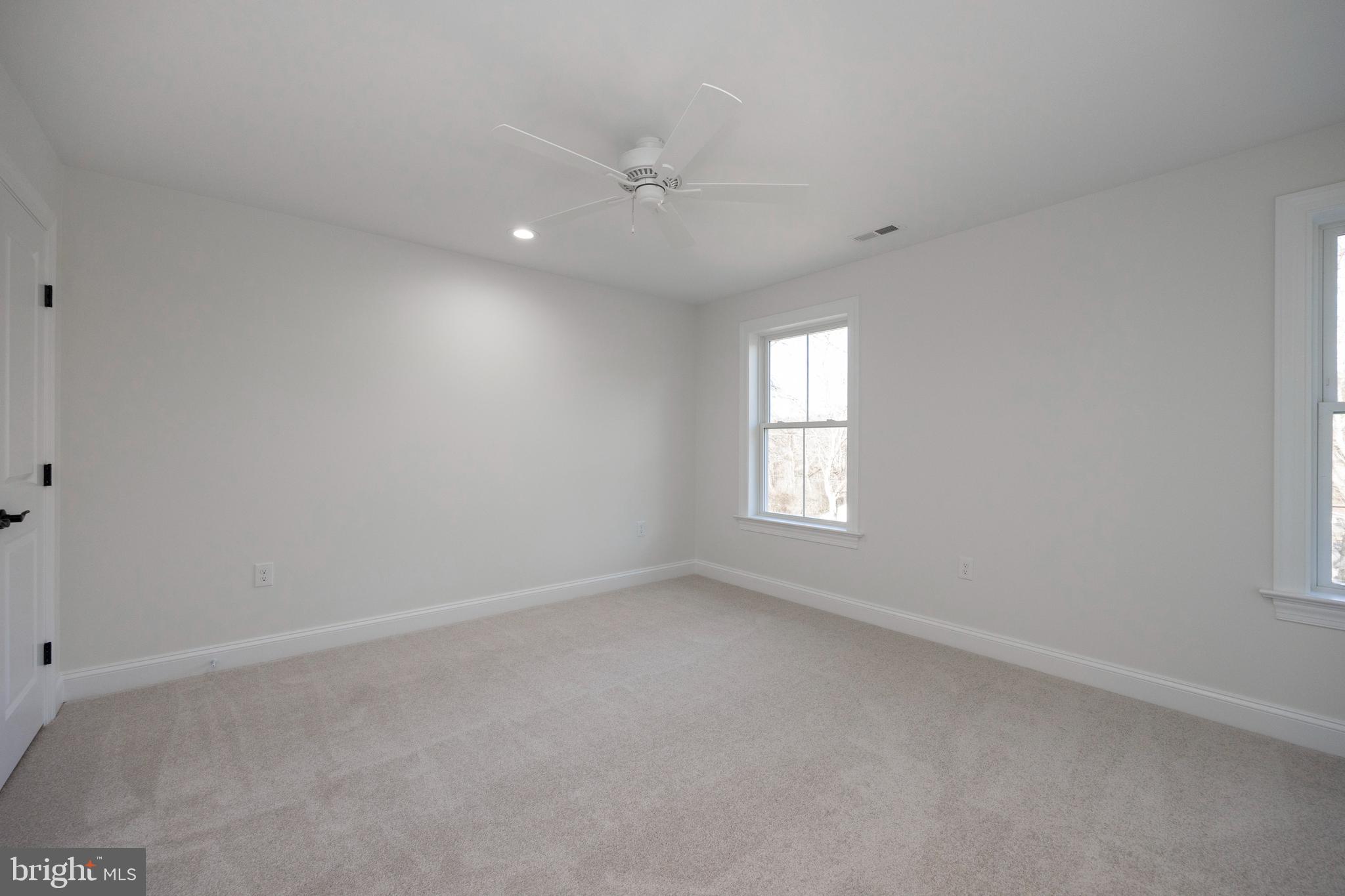 660 Little Conestoga Road Downingtown, PA 19335 - Photo 41 of 56 an empty room with a window and a fan
