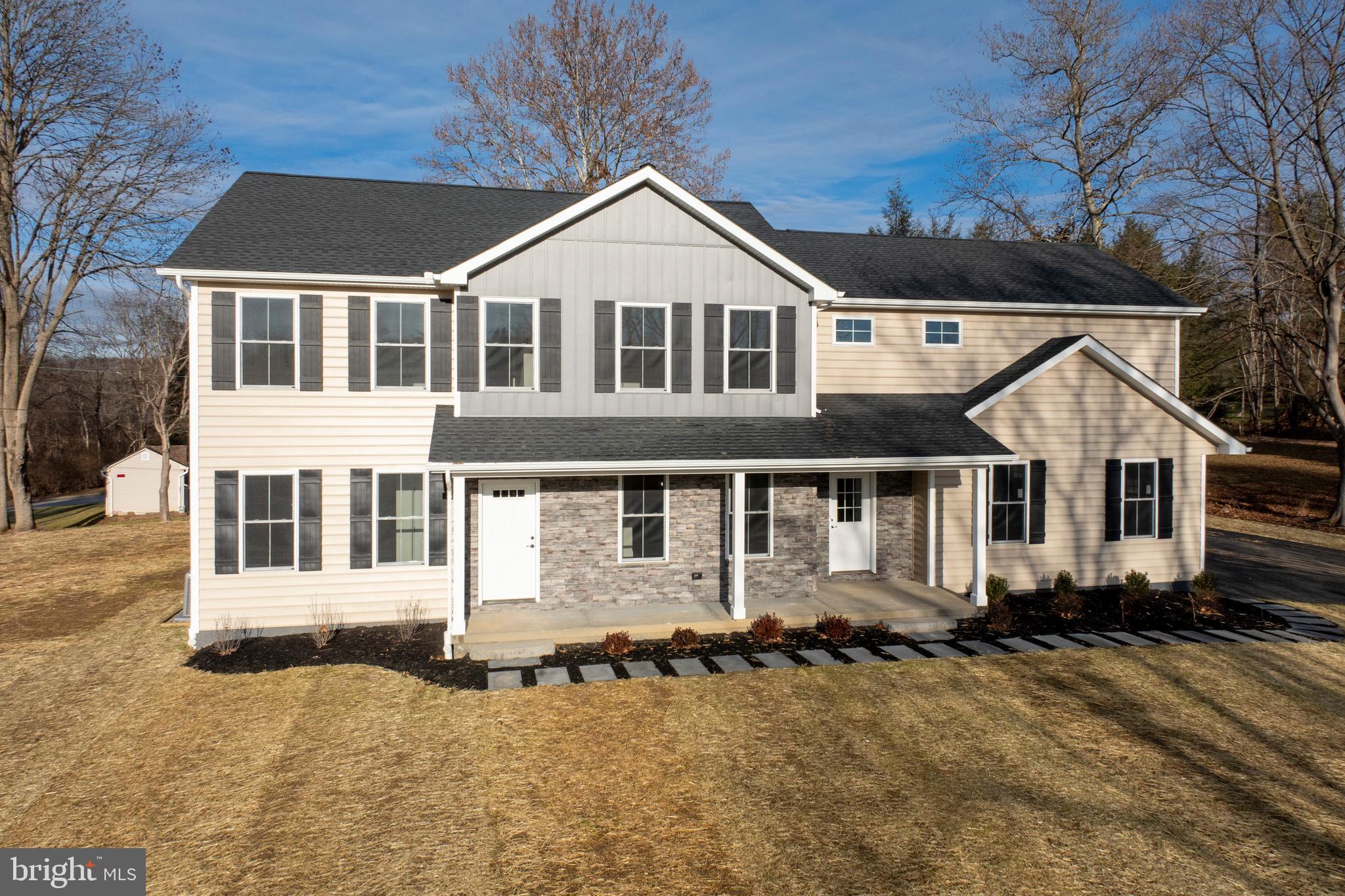660 Little Conestoga Road Downingtown, PA 19335 - Photo 6 of 56 front view of a house with a yard