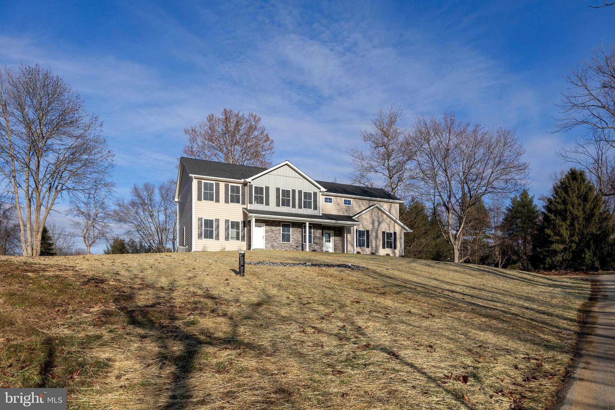 660 Little Conestoga Road Downingtown, PA 19335 - Photo 7 of 56 a front view of a house with a garden