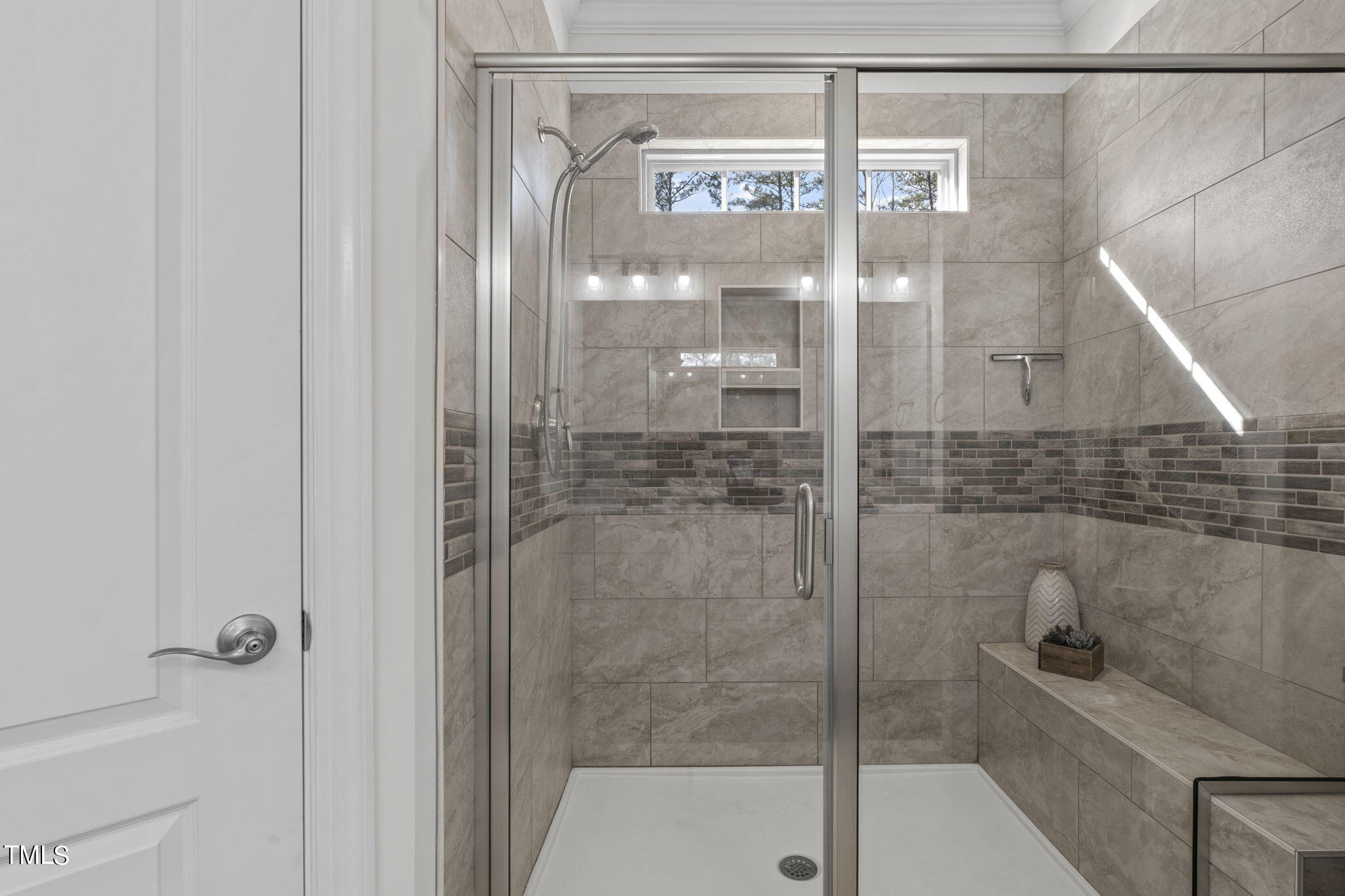 9716 Chris Drive Raleigh, NC 27603 - Photo 34 of 41 Walk-in shower with seating