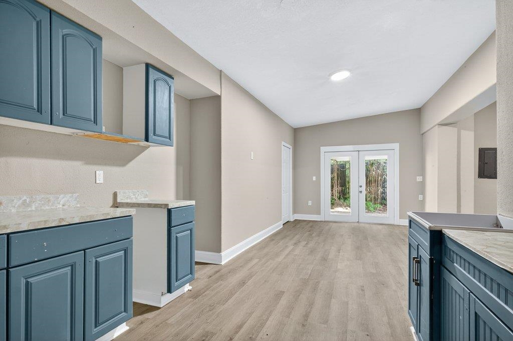 125 Menendez Road St. Augustine, FL 32080 - Photo 29 of 41 a view of a kitchen cabinets and wooden floor