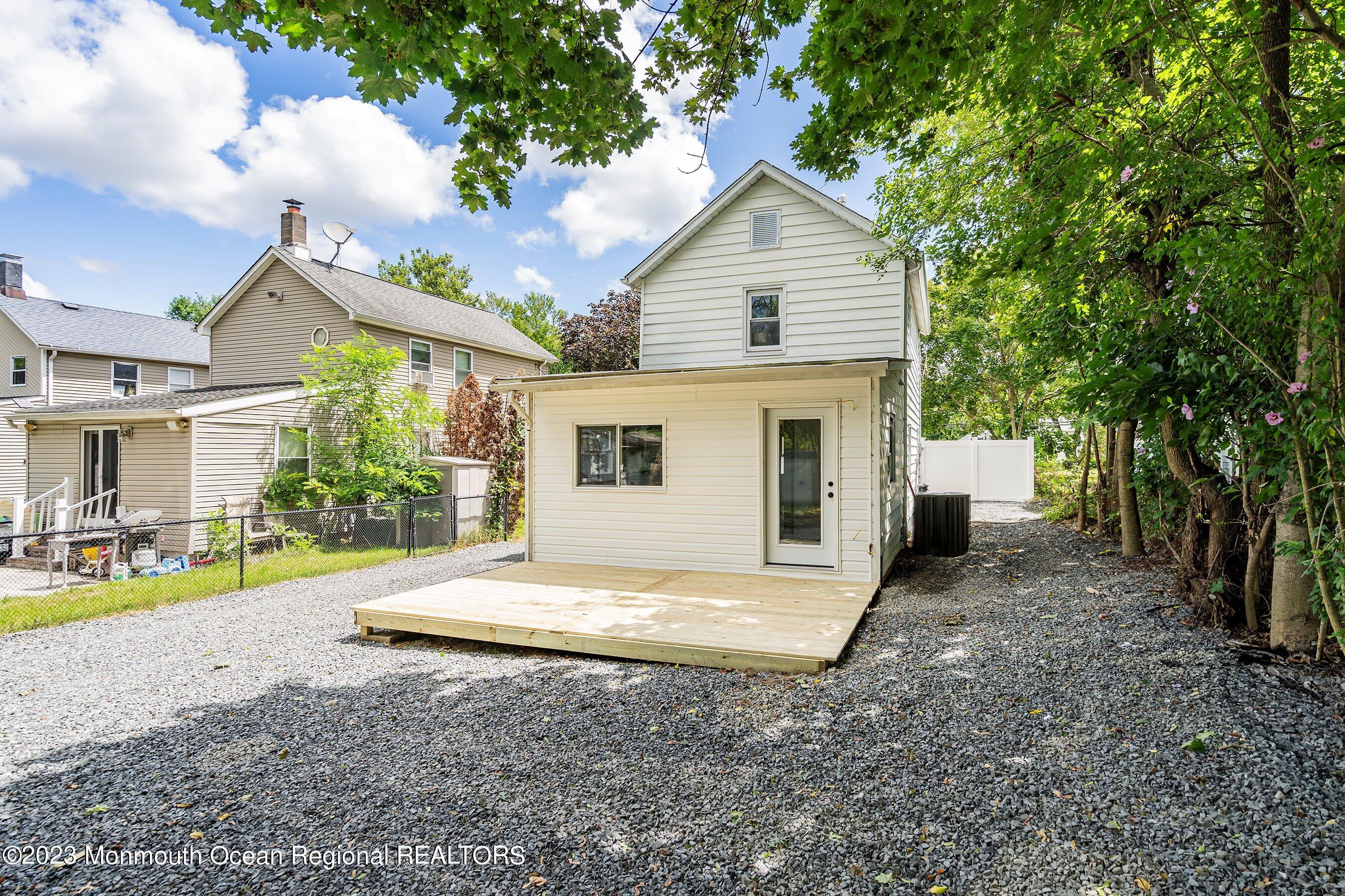 73 Main Street Englishtown, NJ 07726 - Photo 14 of 14 a view of a house with backyard and trees