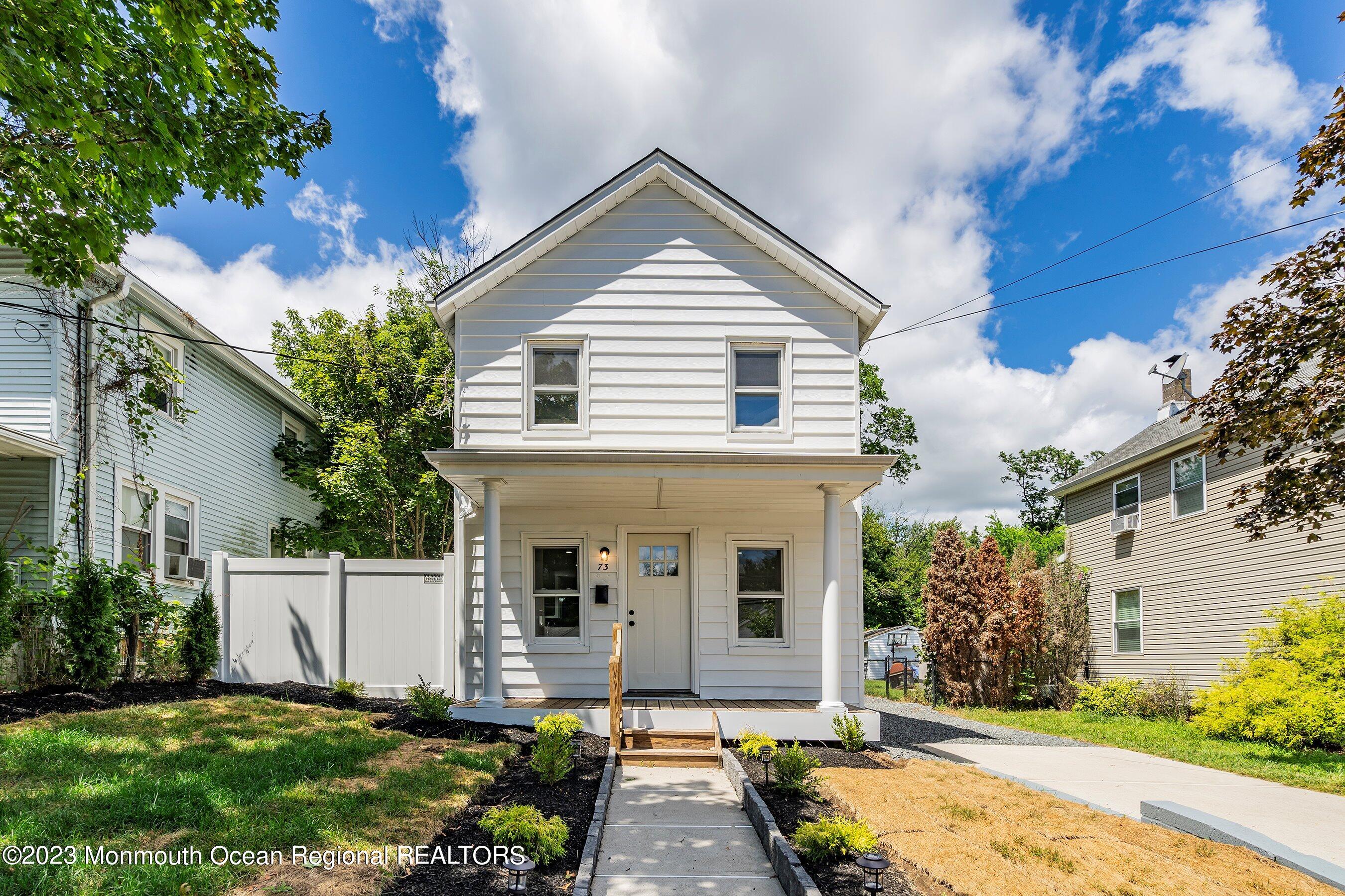 73 Main Street Englishtown, NJ 07726 - Photo 2 of 14 a front view of a house with a yard