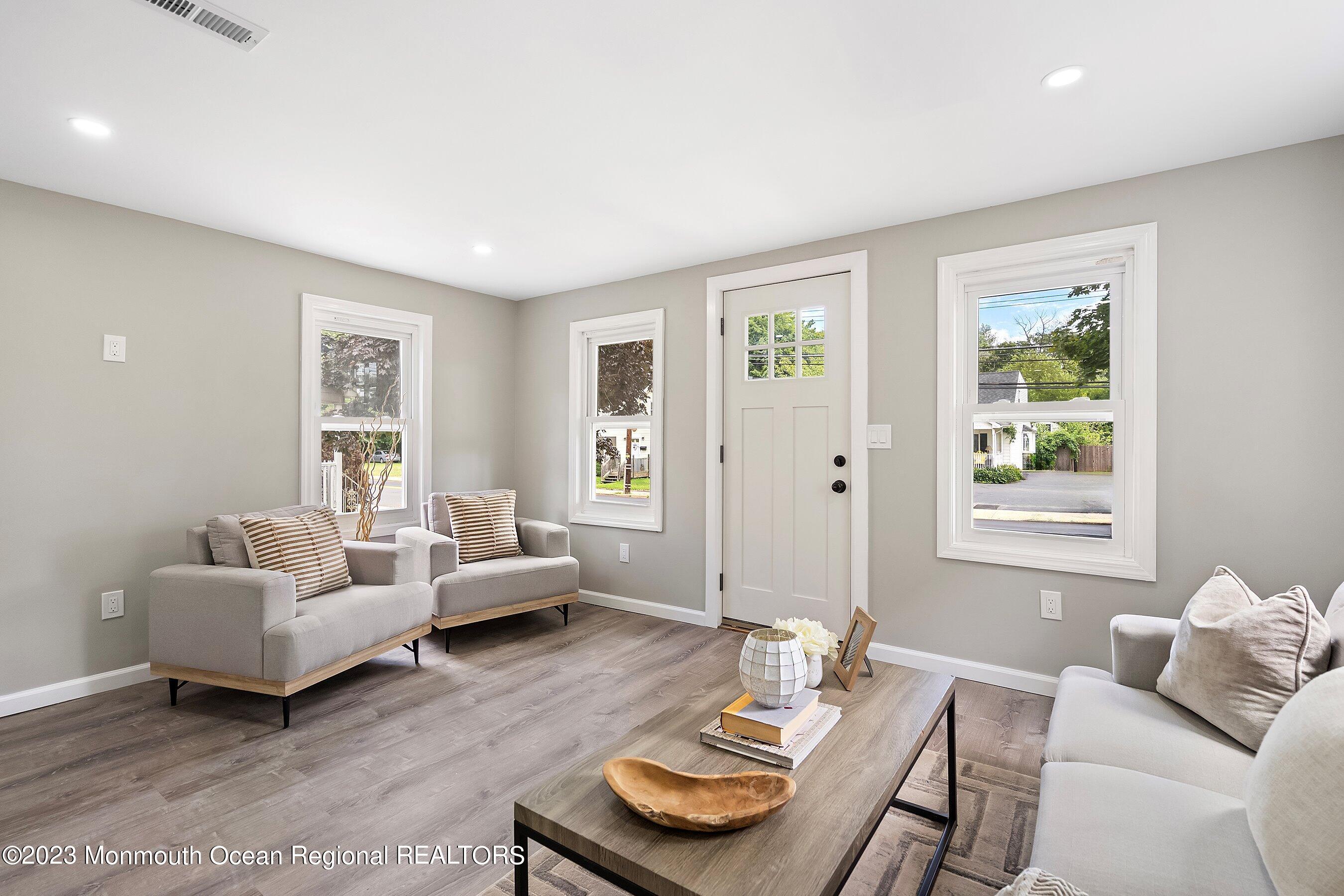 73 Main Street Englishtown, NJ 07726 - Photo 3 of 14 a living room with furniture and a window