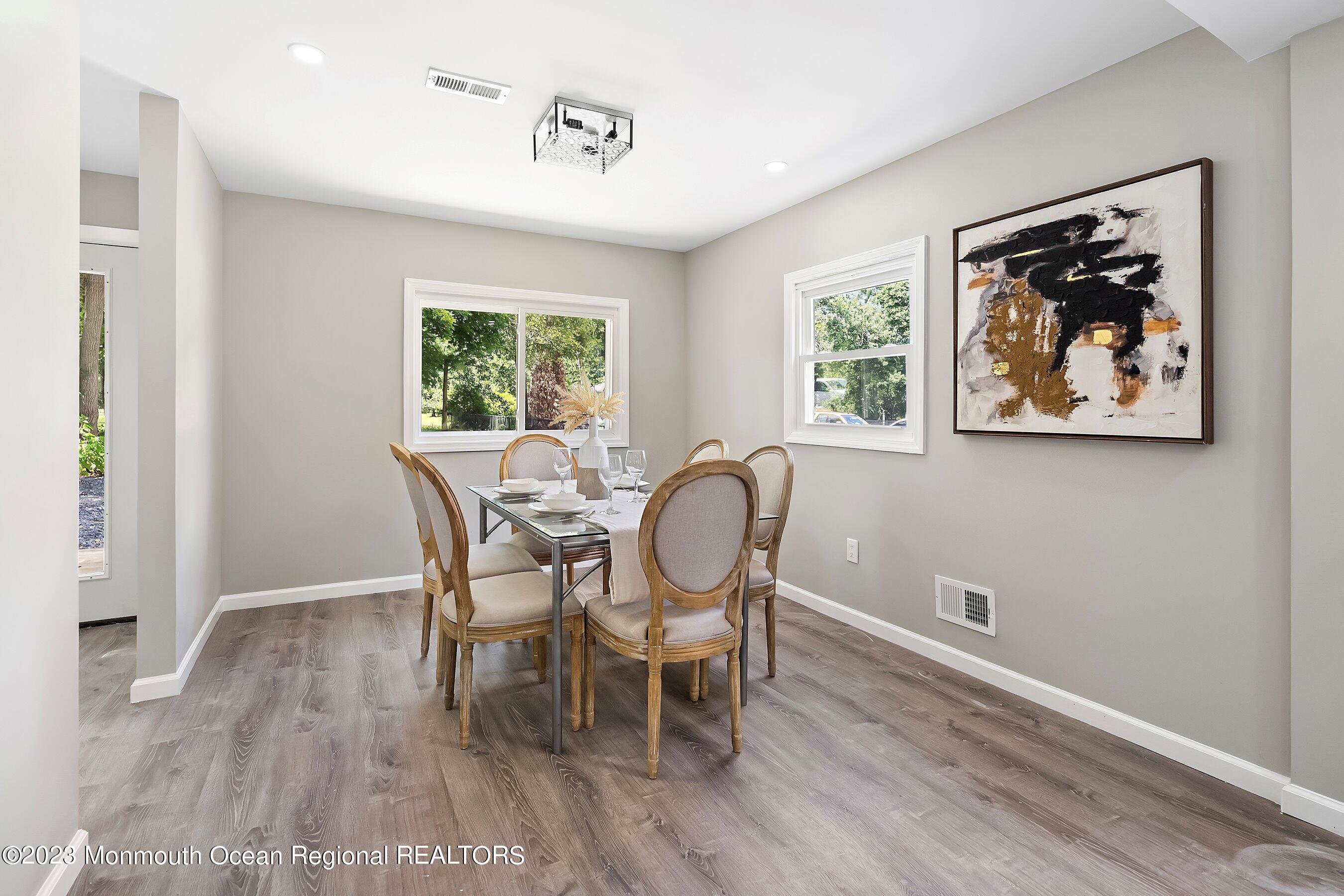 73 Main Street Englishtown, NJ 07726 - Photo 7 of 14 a view of a dining room with furniture window and wooden floor