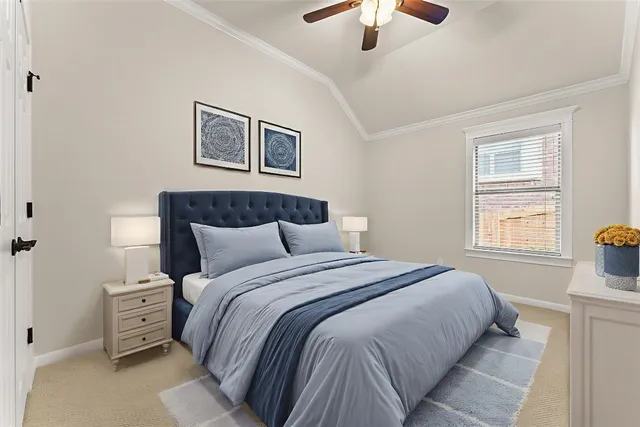 a bedroom with a large bed and a window