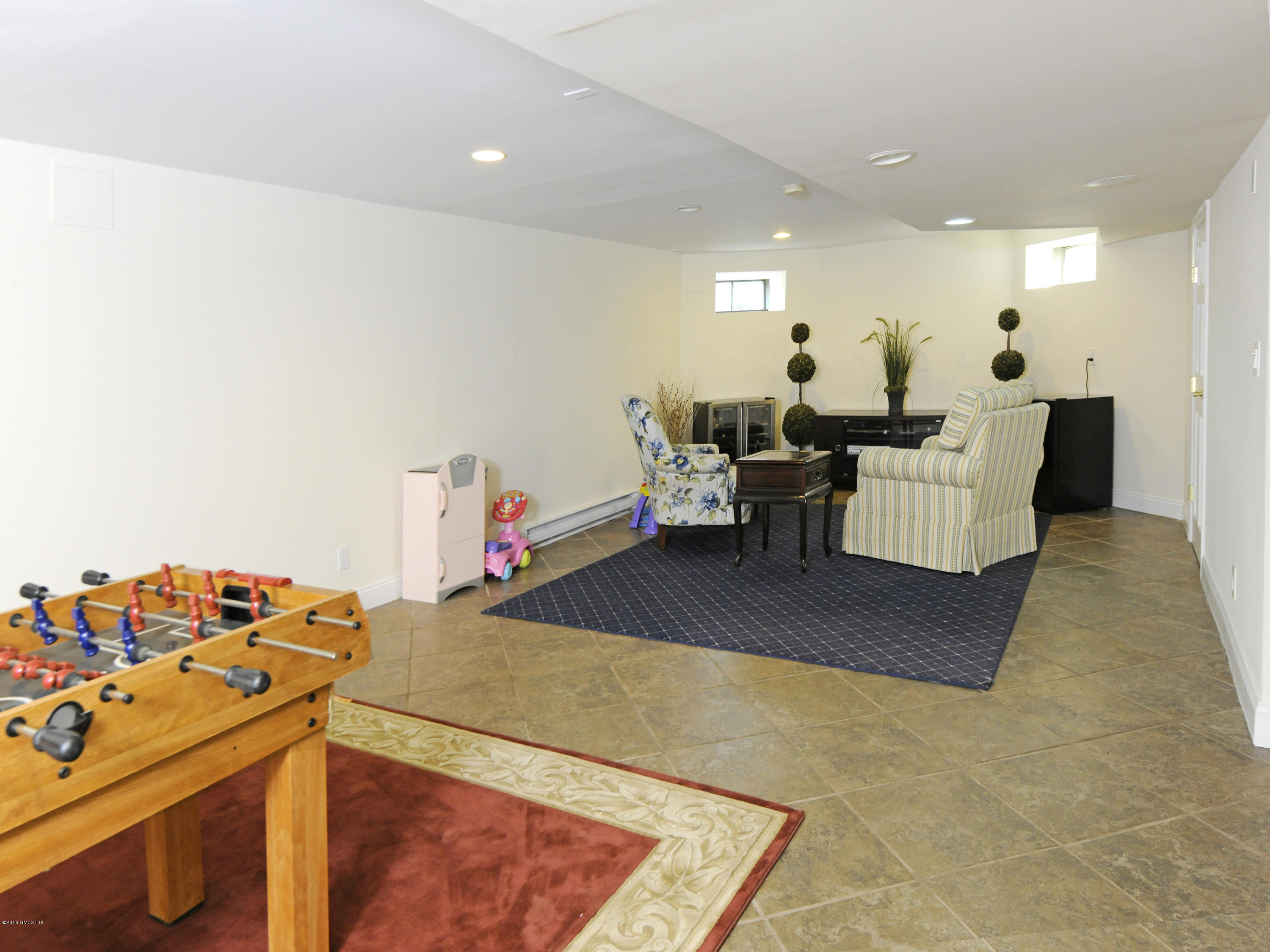 23 Willowmere Avenue Riverside, CT 06878 - Photo 15 of 21 a living room with furniture and a wooden floor