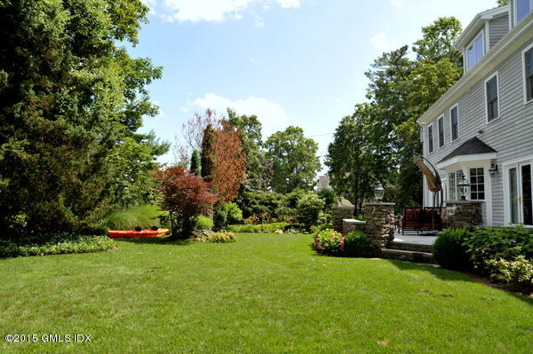 23 Willowmere Avenue Riverside, CT 06878 - Photo 16 of 21 a front view of a house with a garden and trees