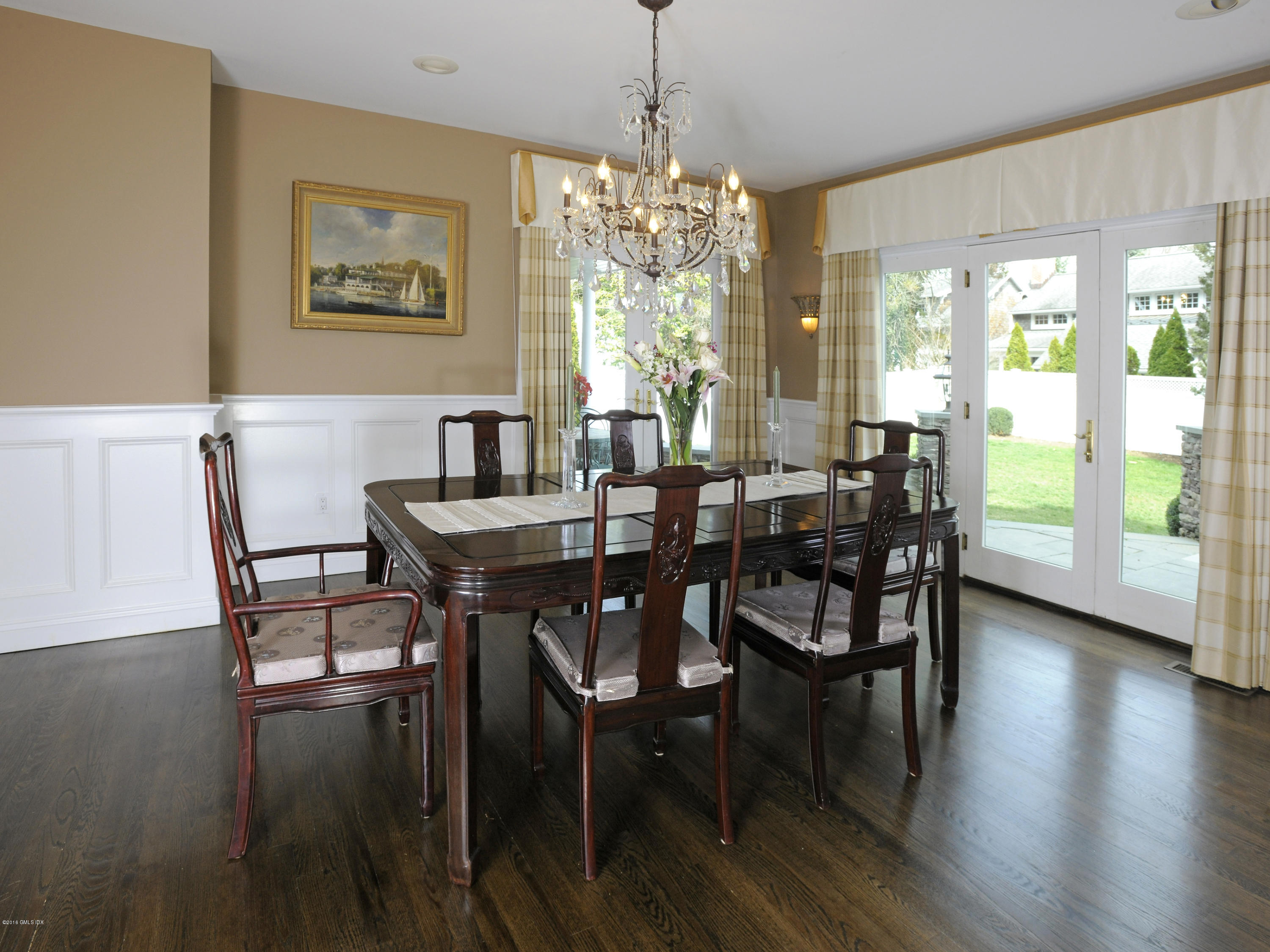 23 Willowmere Avenue Riverside, CT 06878 - Photo 3 of 21 a view of a dining room with furniture wooden floor and a chandelier