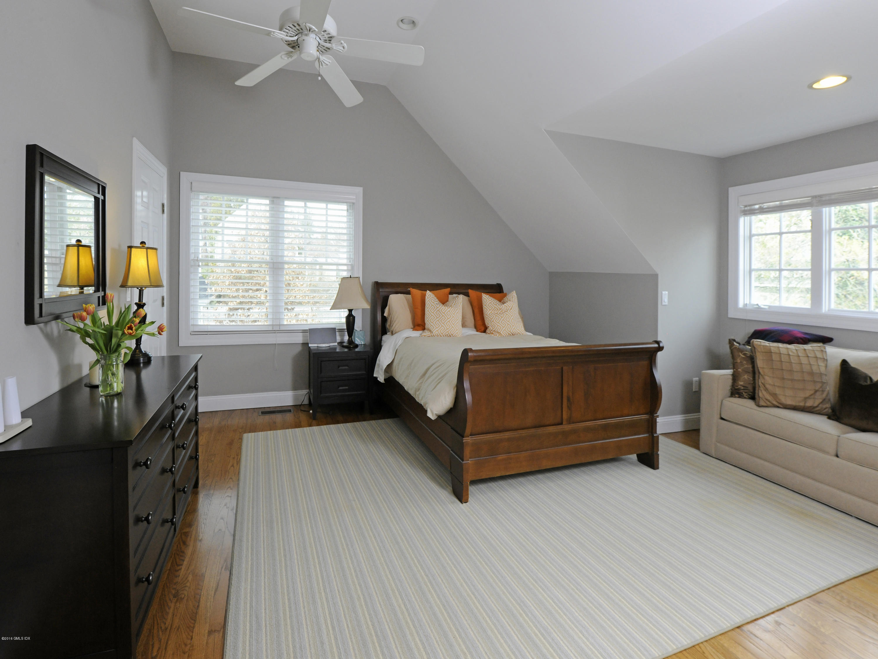23 Willowmere Avenue Riverside, CT 06878 - Photo 10 of 21 a bedroom with a bed couch and window