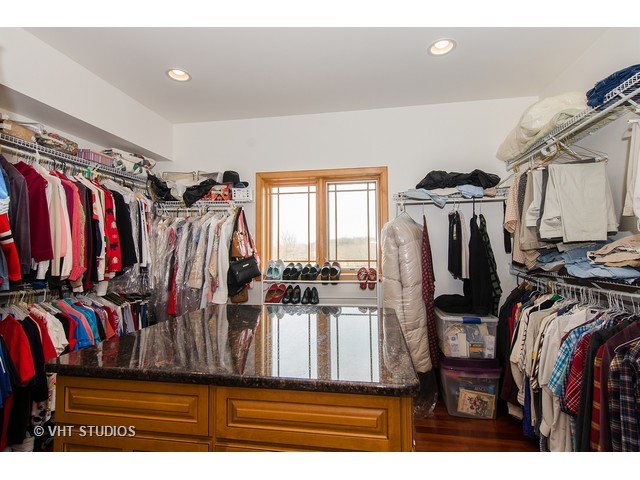11411 Armory Road Hebron, IL 60034 - Photo 16 of 22 a view of walk in closet with clothes and shoes