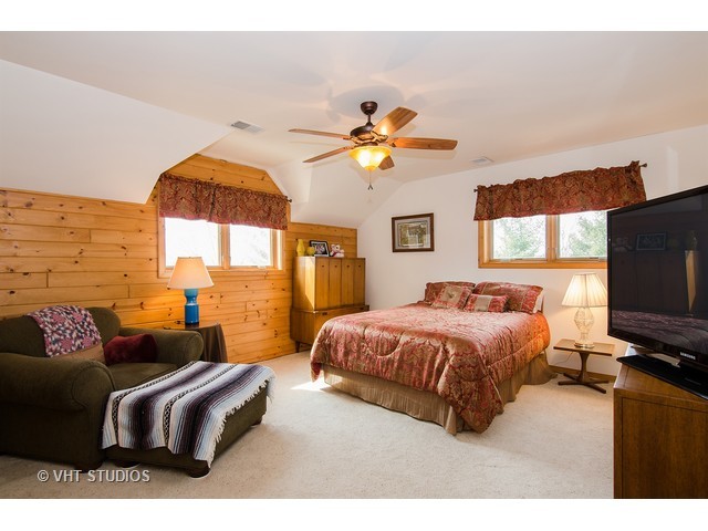 11411 Armory Road Hebron, IL 60034 - Photo 17 of 22 a bedroom with a bed couch and window