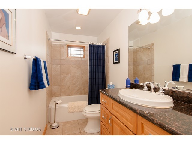 11411 Armory Road Hebron, IL 60034 - Photo 18 of 22 a bathroom with a sink a toilet and shower