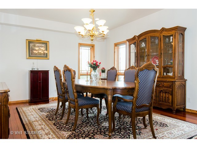11411 Armory Road Hebron, IL 60034 - Photo 5 of 22 a view of a dining room with furniture and a chandelier