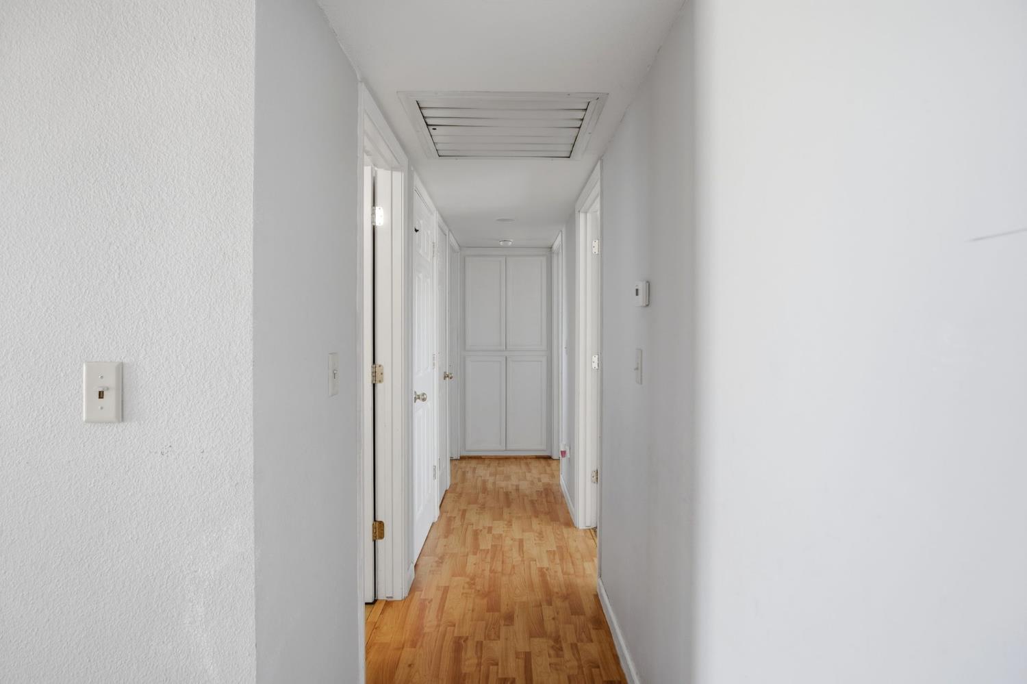 1409 Stonum Road Modesto, CA 95351 - Photo 13 of 40 a view of a hallway with a white door