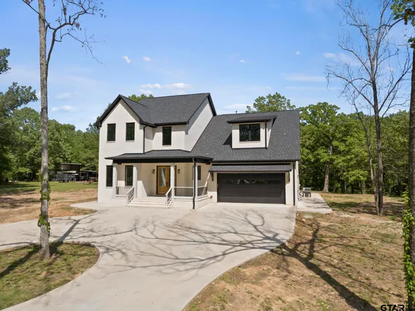 a house with trees in the background