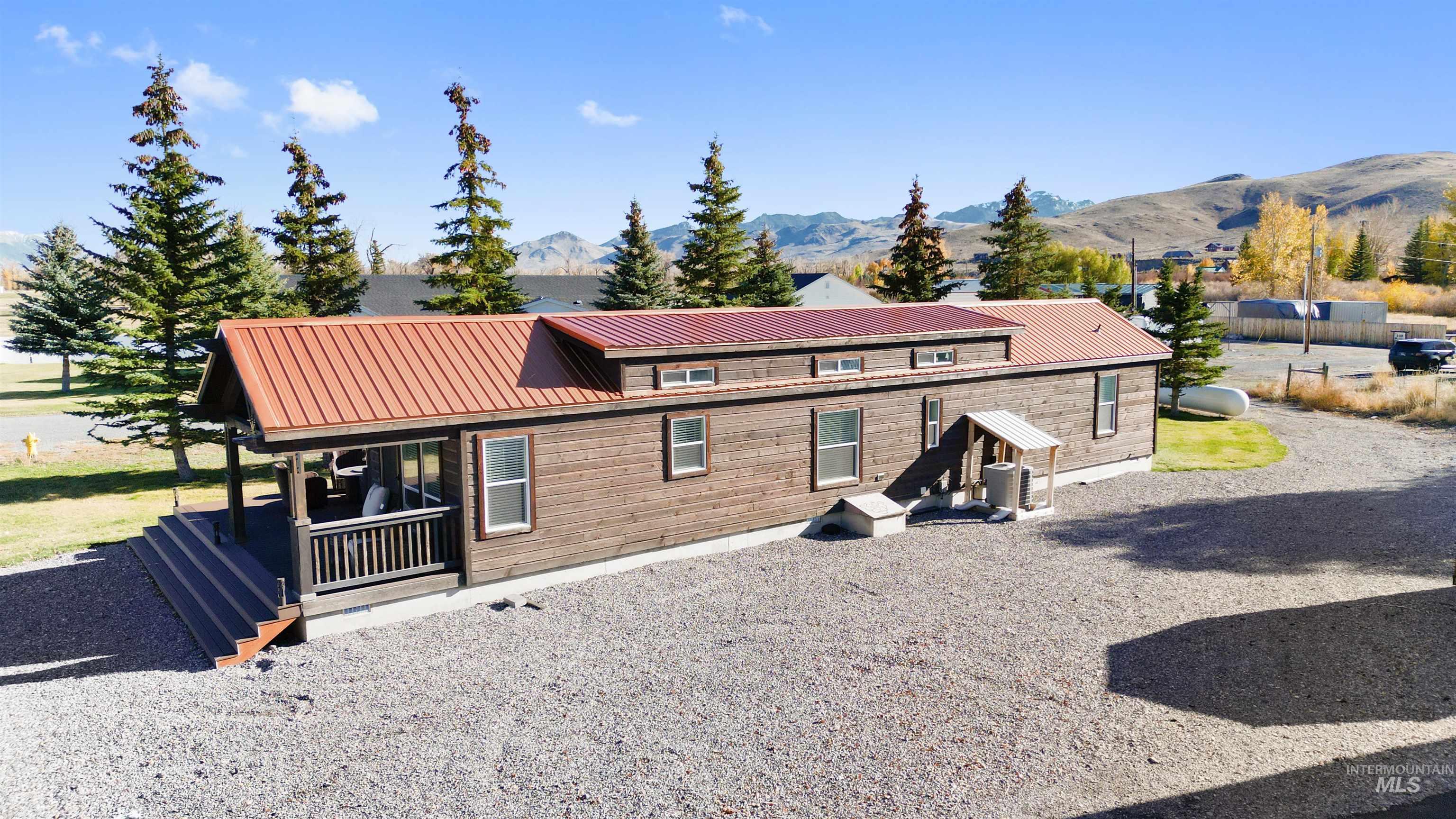 107 Willow Street Mackay, ID 83251 - Photo 21 of 48 Rustic home featuring a metal roof and a mountain view