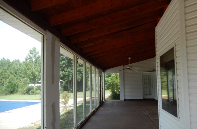 1030 Teagle Road Jackson, GA 30233 - Photo 3 of 7 a view of a room with large windows and wooden roof