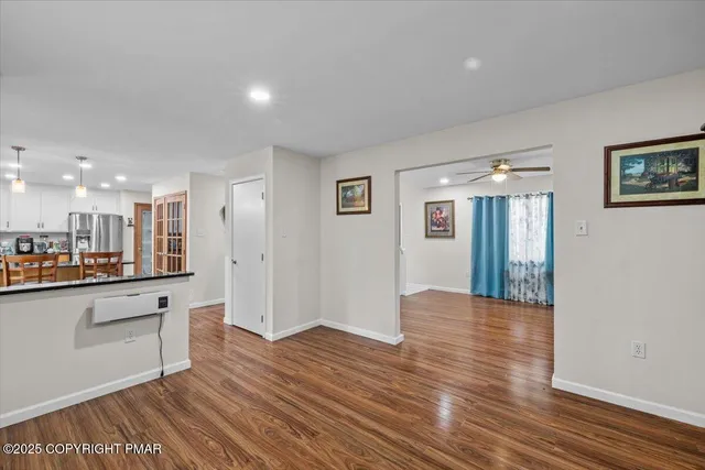 a view of a kitchen cabinets and wooden floor