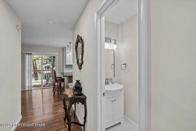 a view of a livingroom with furniture and wooden floor