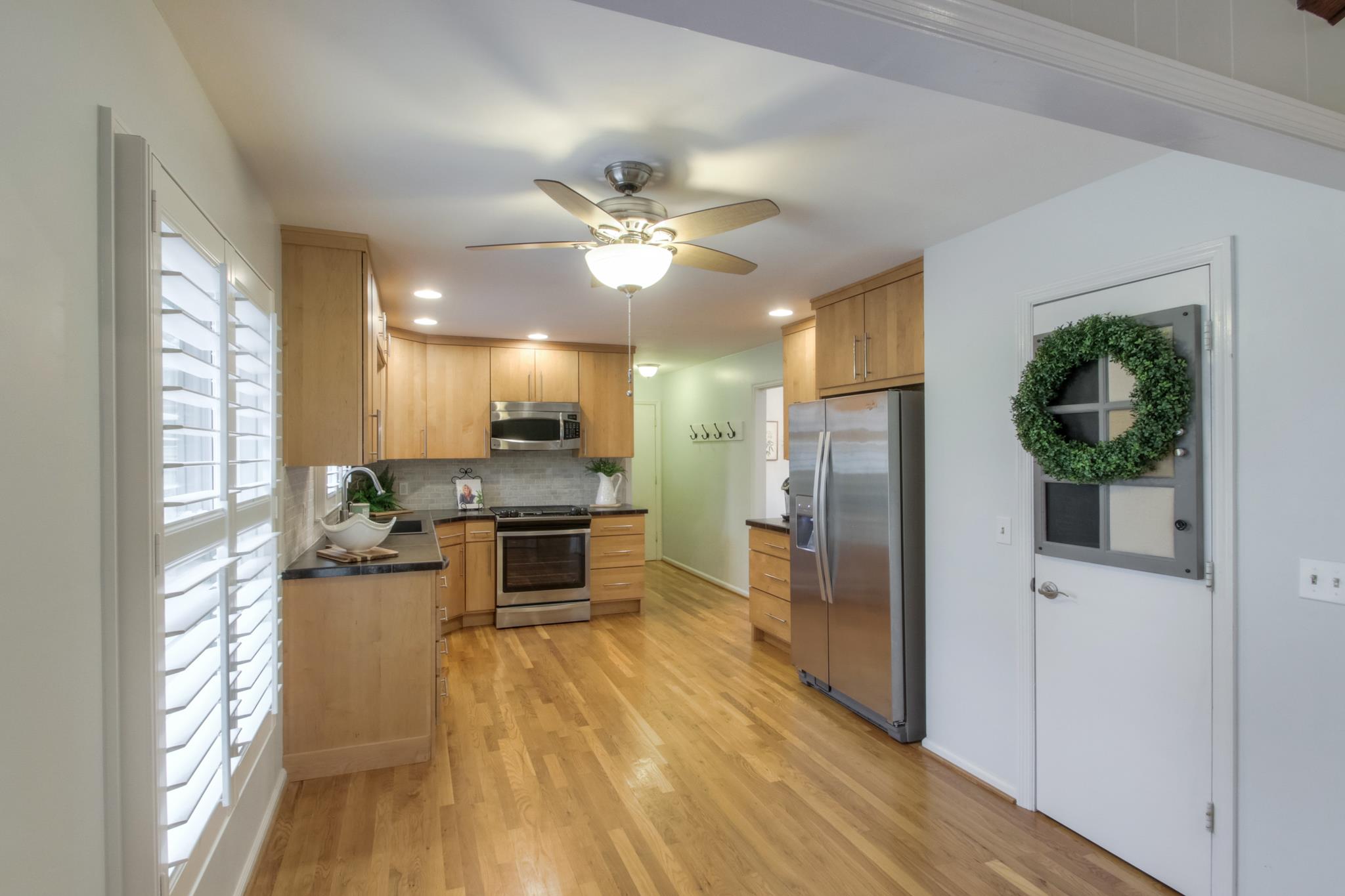 2216 Bowman Road Franklin, TN 37064 - Photo 14 of 30 This eat in kitchen has gleaming hardwoods, maple cabinets, a gas stove and new stainless appliances. Yes, the refrigerator is included!